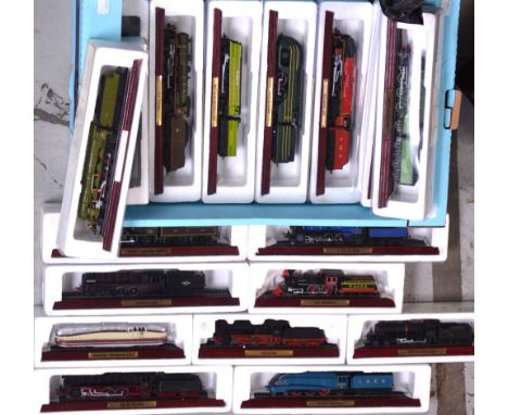 Seventeen boxed scale model locomotives with tenders, each mounted on plinth with inscribed brass plaques (17).