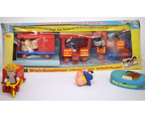 A boxed Corgi 851 'The Magic Roundabout' train with Mr Rusty the engine driver, Dougal, Paul and Rosali, a Mr McHenry scooter