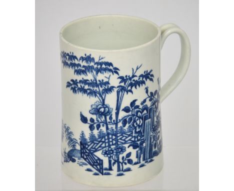 An 18th century Worcester blue and white 'Plantation' pattern tankard of cylindrical form with loop handle, blue crescent mar