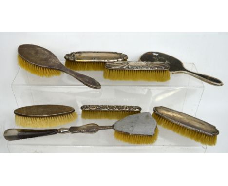 A George V hallmarked silver dressing table set of hairbrush and clothes brush with engine-turned decoration, Hassett & Harpe