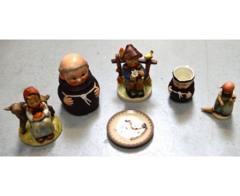 Six pieces of Hummel to include jug in the form of a friar (af), a friar pot with lift-off head, a small boy seated in a coun