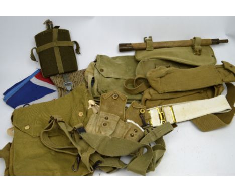 Mixed WWII and later standard-issue webbing and canvas belts, together with standard-issue axe with canvas cover and handle, 