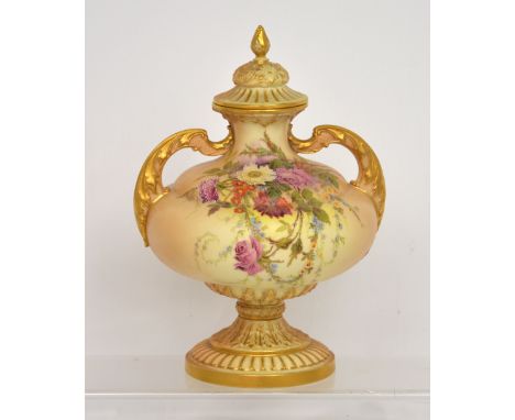 A Royal Worcester blush ivory twin-handled lidded vase painted with floral sprays, highlighted in raised gold, signed by W. H