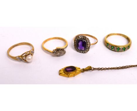 Four ladies' rings; an 18ct gold ring with three diamonds on a twist, size K, a 9ct gold ring with white and green stones, si