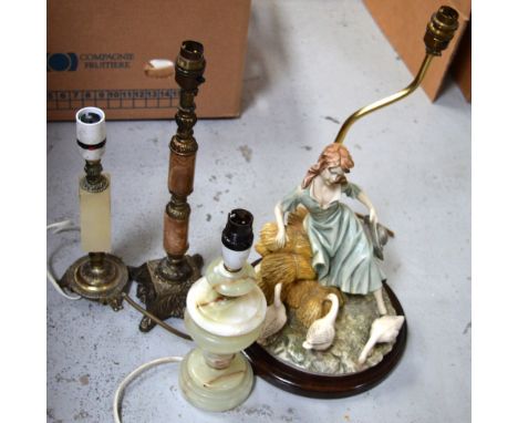 A turned onyx lamp base, a further brass and square onyx lamp base, a metal and faux onyx lamp base and a resin lamp base of 