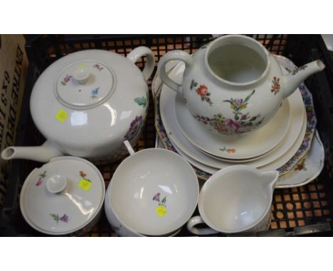 A mid-19th century KPM tea service comprising teapot, two plates, two cups and saucers, sugar bowl and milk jug, hand-painted