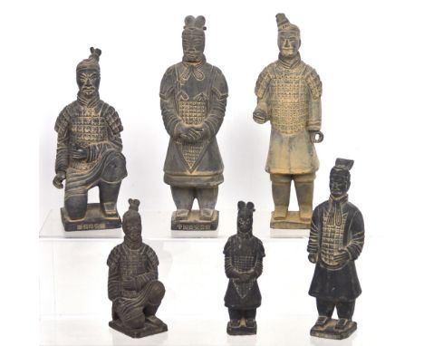 Six various-sized terracotta figurines representing the 'Terracotta Army', largest height 27cm.