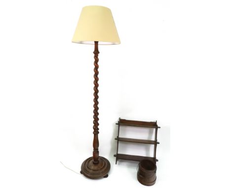 An early 20th century oak spiral column standard lamp, 159cm high, a similar period set of wall hanging shelves, 56cm wide an