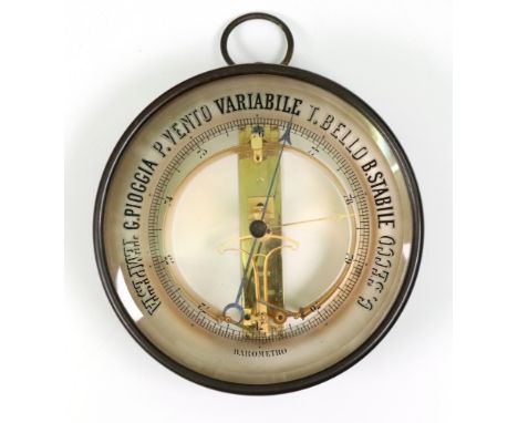 A French gilt metal drum cased barometer, 17cm diameter.