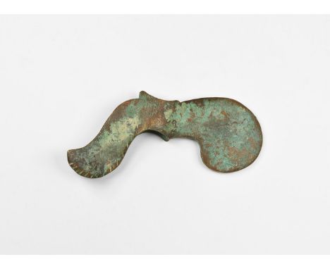 An undated archaistic bronze axehead with elliptical-section socket, rounded blade, scooped rear flange with notched edge.  3