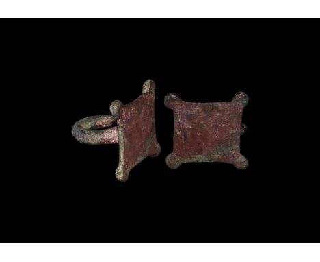 2nd century BC-1st century AD. A bronze terret on rectangular base with corner lugs, round-section hoop.  25 grams, 31mm. (1 