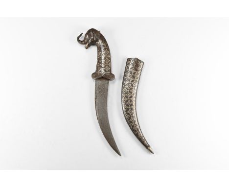 20th century AD. An iron khanjar dagger with inlay to the curved blade, hilt formed as an elephant's head, scabbard with loze