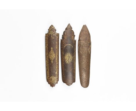 19th century AD. A mixed group of iron scabbard chapes, each with parcel-gilt flowers and tendrils.  268 grams total, 15-16cm