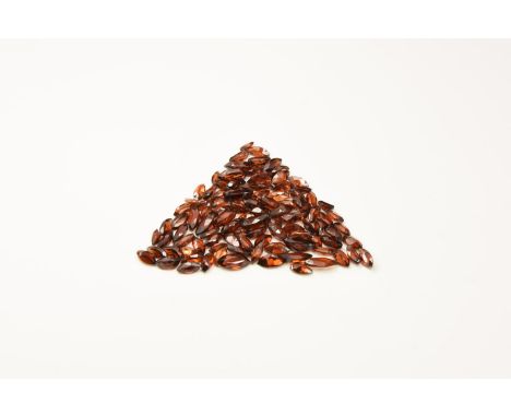 Natural History - A group of one hundred marquise-cut garnets of a deep red-brown colour.  8.29 grams total, 4-8mm (1/4"). Fr