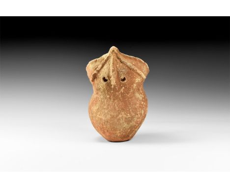 16th century AD. A ceramic coarse ware vessel in the form of a stylized human figure with large head, central rib to form the