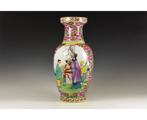 20th century AD. A glazed ceramic vase with flared base and waisted neck, pink and yellow floral ornament framing two scenes 