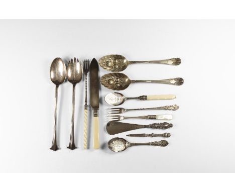 19th century AD. A mixed group of mainly silver-plated cutlery items including pickle forks, a bone-handled knife, table spoo