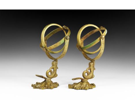 20th century AD. A matched pair of bronze sconces, each an acanthus-leaf bracket with projecting fish supporting a gimbal.  9