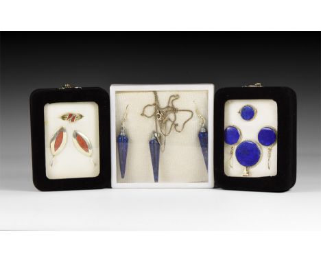 20th century AD. A group of three jewellery sets in silver-coloured metal with lapis lazuli and enamel(?) inserts, each in a 