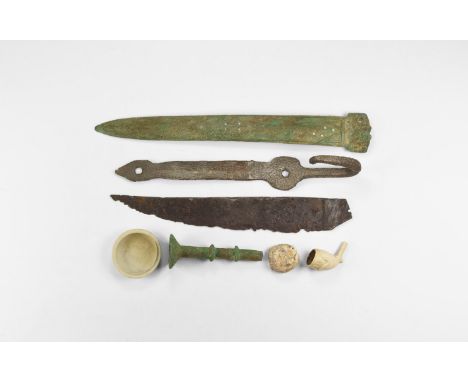 A mixed group of undated archaistic items comprising: a Chinese style sword; an iron suspension hook with strap; an iron knif