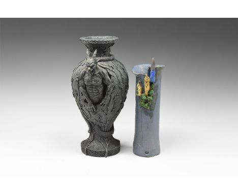 20th century AD. A mixed group comprising: a composition vase with creepers and two horned devils to the sides; an artisan-ma