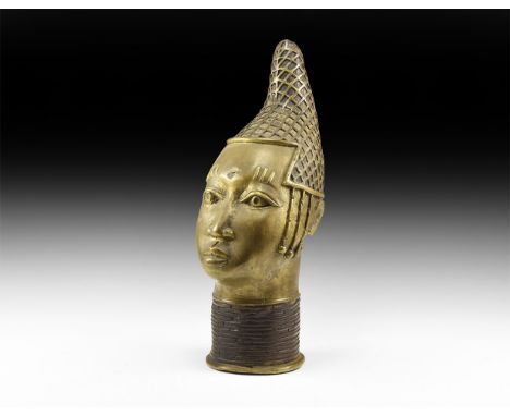 20th century AD. A hollow-cast bronze Benin-style bust with lattice texture to the 'liberty cap' headgear, ringed collar to t