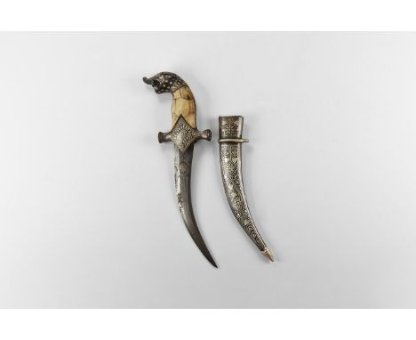20th century AD. An iron khanjar dagger with curved blade, bone plaques to the grip, pommel with panther-head finial, inly to