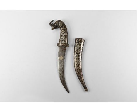 20th century AD. An iron khanjar dagger with inlay to the curved blade, hilt formed as an elephant's head, scabbard with loze