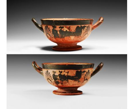 19th century AD or earlier. A broad ceramic vessel with pedestal foot, gallery below the rim, two strap handles; band of pain