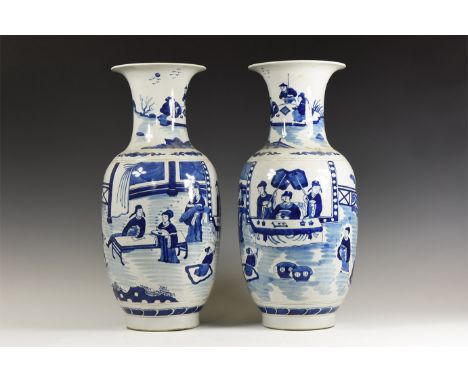 20th century AD. A matched pair of glazed ceramic vases each with trumpet-shaped mouth, courtly scenes in shades of blue to b