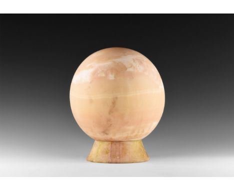 20th century AD. A large alabaster globe with hollowed out tubular section to the middle with flat base; flared separate base