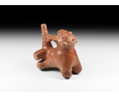 10th-15th century AD. A ceramic stirrup jar formed as a jaguar resting on the forelegs and with hindlegs turned, tail forming