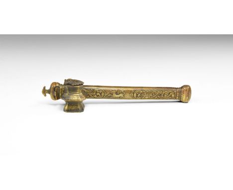 An undated archaistic brass rectangular pen or brush case with low-relief decoration of a running dog and entangled foliage; 