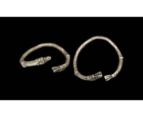 An undated archaistic square-section silver bracelet with balusters and wolf-head finials, notched edges, toughra and bis m'A