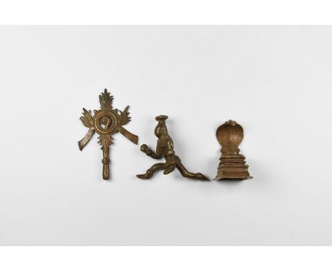 20th century AD. A mixed group of copper-alloy statuettes comprising of: a crawling infant Krishna wearing a tall elaborate c