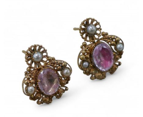A pair of pink stone and half pearl gold earrings, cannetille work design, each 18 by 18cm, 5.3g overall. (2)