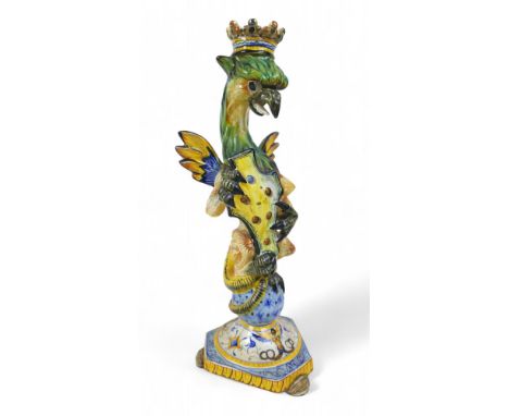 A Cantagalli grotesque candlestick, 15 by 13 by 35cm high.