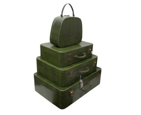 Vintage Luggage; A set of four Pukka Luggage green faux crocodile leather effect suitcases (assorted sizes, includes one vani