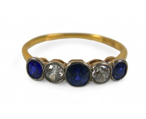 An 18ct yellow gold diamond and sapphire five stone ring, size R, weight 2.0g, diamonds approximately 0.1ct each.