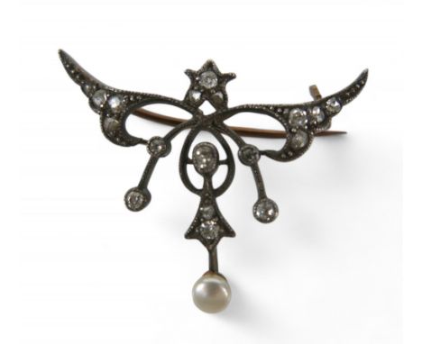 A white and gilt metal Belle Epoque style brooch, set with eleven small diamonds and a pearl, 34 by 6 by 26mm, 3.4g.