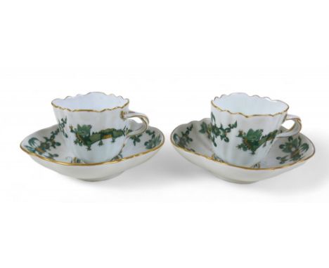 A pair of Meissen green dragon cups and saucers, 13 by 12 by 7cm high.