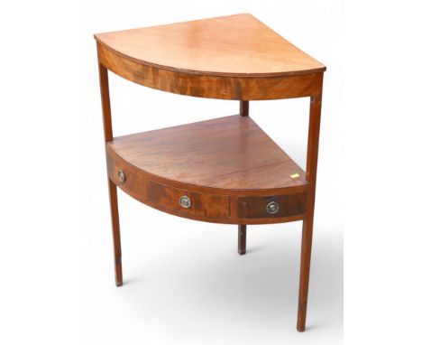 A Georgian mahogany corner table, with single drawer with ring brass handles, single shelf below.