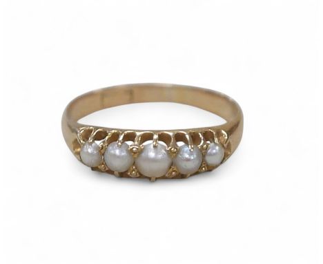 An 18ct gold pearl ring, the largest of the five graduated pearls, 3mm diameter, smallest approximately 2.5mm, rubbed hallmar