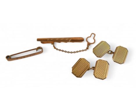 A pair of 9ct yellow gold cufflinks, a tie clip and a pin, total weight 10.5g. (4)