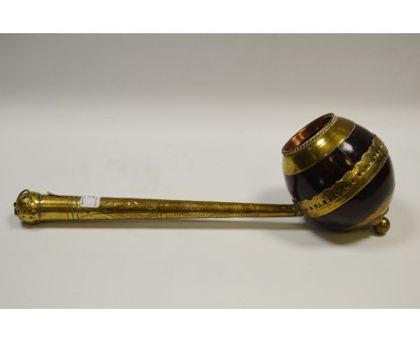 A 19th century coconut shell dipper or ladle 