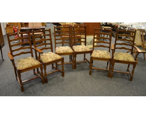 A set of six mid-20th Century mahogany shaped ladder-back dining chairs, H-stretchers, including two carvers