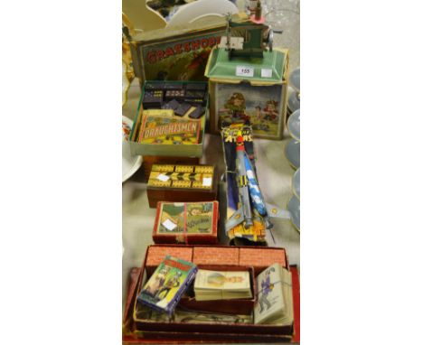 Toys - a 'Little Betty' child's sewing machine, boxed; a Super Missile Atlas Rocket, boxed; Astronaut card game; a cribbage b