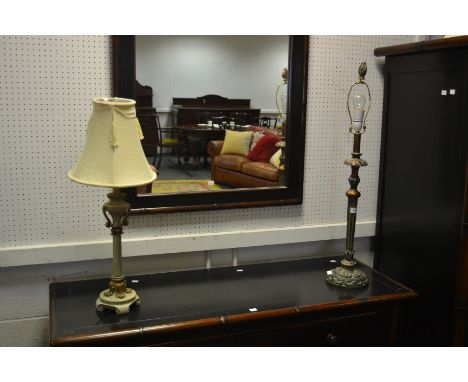 A contemporary soft wood and gesso lamp base; another turned column lamp base in tones of cream picked out in gilt (2)