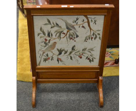 A light oak tapestry fire screen depicting birds on vines