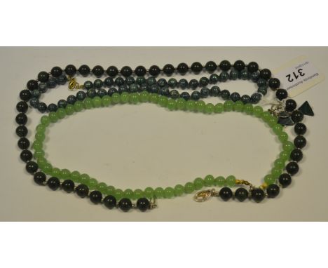 A string of malachite beads;  a pair of malachite earrings;  other green simulated jade beads